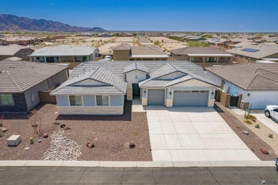 Experience luxury desert living in this stunning 4-bedroom on Las Barrancas Golf Course in Arizona - for sale on GolfHomes.com, golf home, golf lot