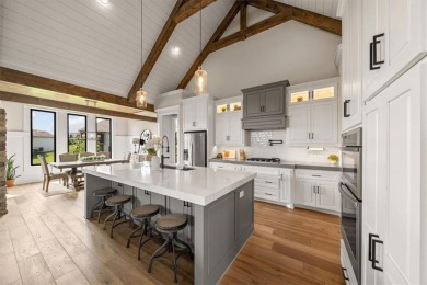 Welcome to this exceptional reverse 1.5-story walkout home in on Fred Arbanas Golf Course At Longview Lakes - Longview Lake in Missouri - for sale on GolfHomes.com, golf home, golf lot