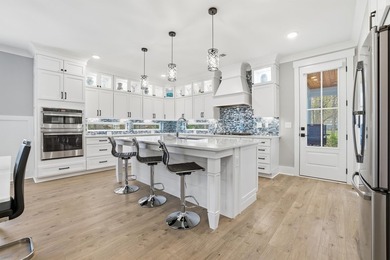 Set within the gated elegance of Pawleys Plantation Golf & on Pawleys Plantation Golf and Country Club in South Carolina - for sale on GolfHomes.com, golf home, golf lot