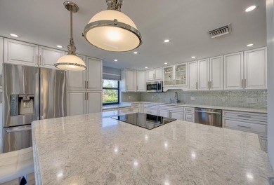 Beautifully remodeled spacious open floor plan located on the on Quail Ridge Golf Course and Country Club in Florida - for sale on GolfHomes.com, golf home, golf lot