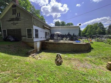 Welcome to 514 Main St in Alpha, Michigan--a unique property on George Young Golf Course in Michigan - for sale on GolfHomes.com, golf home, golf lot