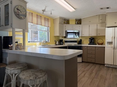 Welcome to your slice of paradise in the vibrant, 55+ Spanish on Spanish Lakes Fairways in Florida - for sale on GolfHomes.com, golf home, golf lot