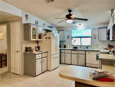 BRAND NEW WINDOWS! This home is perfectly situated near on Indianwood Golf and Country Club in Florida - for sale on GolfHomes.com, golf home, golf lot