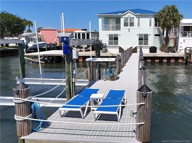 Waterfront living at its best! This fully furnished 2BD on Island Dunes Country Club in Florida - for sale on GolfHomes.com, golf home, golf lot