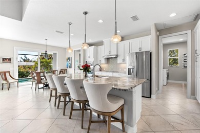 Live the Florida Dream! This stunning custom-built waterfront on Rotonda Golf and Country Club - Long Marsh  in Florida - for sale on GolfHomes.com, golf home, golf lot