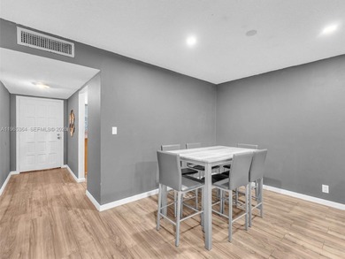 Experience elevated living in this beautifully 2-bedroom, 2-bath on Inverrary Country Club in Florida - for sale on GolfHomes.com, golf home, golf lot