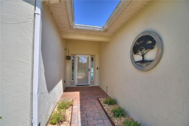 Welcome to this beautifully updated 2-bedroom, 2-bathroom home on Lake Ashton Golf Club in Florida - for sale on GolfHomes.com, golf home, golf lot