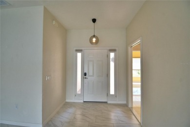 Welcome to this beautifully updated 2-bedroom, 2-bathroom home on Lake Ashton Golf Club in Florida - for sale on GolfHomes.com, golf home, golf lot