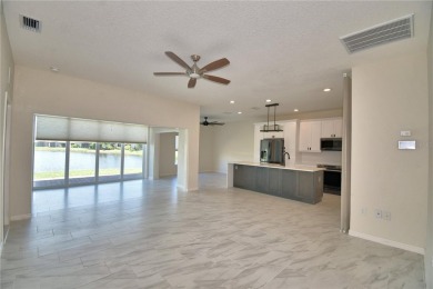 Welcome to this beautifully updated 2-bedroom, 2-bathroom home on Lake Ashton Golf Club in Florida - for sale on GolfHomes.com, golf home, golf lot