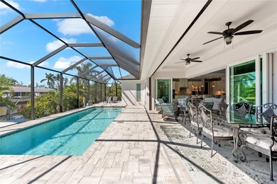 Live the Florida Dream! This stunning custom-built waterfront on Rotonda Golf and Country Club - Long Marsh  in Florida - for sale on GolfHomes.com, golf home, golf lot