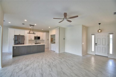 Welcome to this beautifully updated 2-bedroom, 2-bathroom home on Lake Ashton Golf Club in Florida - for sale on GolfHomes.com, golf home, golf lot