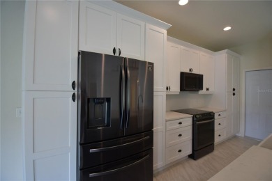 Welcome to this beautifully updated 2-bedroom, 2-bathroom home on Lake Ashton Golf Club in Florida - for sale on GolfHomes.com, golf home, golf lot