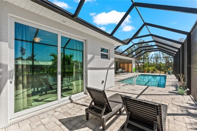 Live the Florida Dream! This stunning custom-built waterfront on Rotonda Golf and Country Club - Long Marsh  in Florida - for sale on GolfHomes.com, golf home, golf lot
