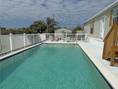 Spacious WATERFRONT Gulf access 2005 manufactured home located on Saint Andrews South Golf Club in Florida - for sale on GolfHomes.com, golf home, golf lot