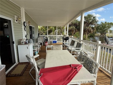 Spacious WATERFRONT Gulf access 2005 manufactured home located on Saint Andrews South Golf Club in Florida - for sale on GolfHomes.com, golf home, golf lot