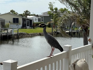 Spacious WATERFRONT Gulf access 2005 manufactured home located on Saint Andrews South Golf Club in Florida - for sale on GolfHomes.com, golf home, golf lot