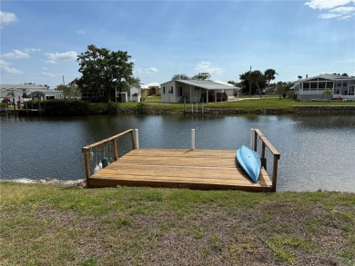 Spacious WATERFRONT Gulf access 2005 manufactured home located on Saint Andrews South Golf Club in Florida - for sale on GolfHomes.com, golf home, golf lot