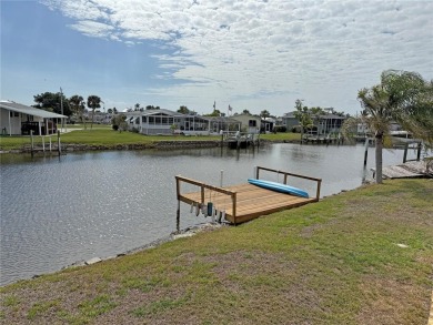 Spacious WATERFRONT Gulf access 2005 manufactured home located on Saint Andrews South Golf Club in Florida - for sale on GolfHomes.com, golf home, golf lot