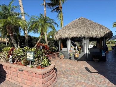 Welcome to this tropical sanctuary, where luxury and attention on St. Lucie Trail Golf Club in Florida - for sale on GolfHomes.com, golf home, golf lot