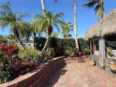 Welcome to this tropical sanctuary, where luxury and attention on St. Lucie Trail Golf Club in Florida - for sale on GolfHomes.com, golf home, golf lot