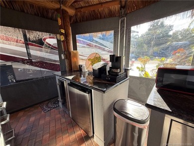 Welcome to this tropical sanctuary, where luxury and attention on St. Lucie Trail Golf Club in Florida - for sale on GolfHomes.com, golf home, golf lot