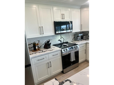 Beautifully renovated 2/2 condo with stunning views of the Coral on Coral Ridge Country Club in Florida - for sale on GolfHomes.com, golf home, golf lot