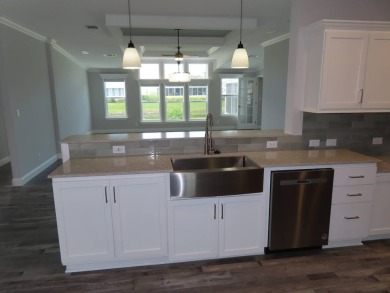 This never owned new Palm Harbor Black Diamond model is ready on Crane Lakes Golf and Country Club in Florida - for sale on GolfHomes.com, golf home, golf lot