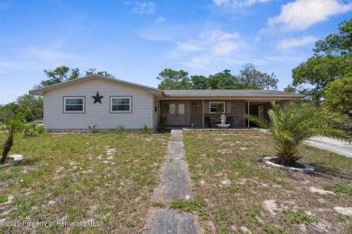 Welcome to this beautifully maintained 3-bedroom, 2-bath home on Oak Hills Country Club in Florida - for sale on GolfHomes.com, golf home, golf lot