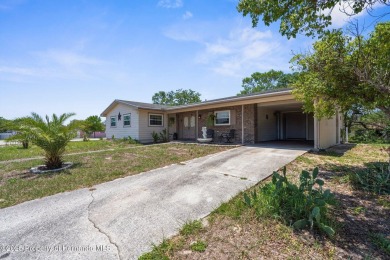 Welcome to this beautifully maintained 3-bedroom, 2-bath home on Oak Hills Country Club in Florida - for sale on GolfHomes.com, golf home, golf lot
