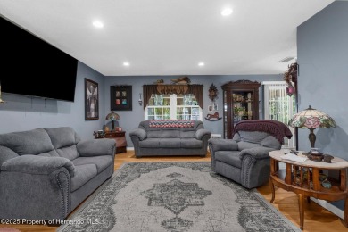 Welcome to this beautifully maintained 3-bedroom, 2-bath home on Oak Hills Country Club in Florida - for sale on GolfHomes.com, golf home, golf lot