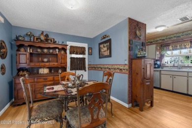 Welcome to this beautifully maintained 3-bedroom, 2-bath home on Oak Hills Country Club in Florida - for sale on GolfHomes.com, golf home, golf lot