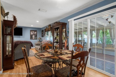 Welcome to this beautifully maintained 3-bedroom, 2-bath home on Oak Hills Country Club in Florida - for sale on GolfHomes.com, golf home, golf lot