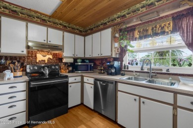 Welcome to this beautifully maintained 3-bedroom, 2-bath home on Oak Hills Country Club in Florida - for sale on GolfHomes.com, golf home, golf lot