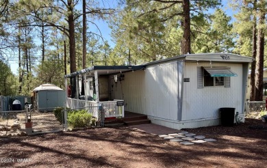 Check out this 2 bedroom, 1 bath home nestled in the tall pines on Bison Golf and Country Club in Arizona - for sale on GolfHomes.com, golf home, golf lot