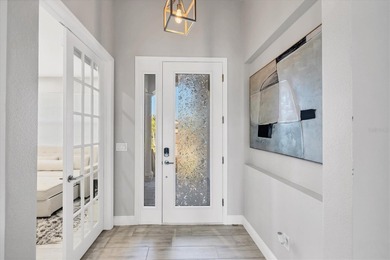 Located in the gated waterfront community of Legends Bay and on IMG Academies Golf and Country Club in Florida - for sale on GolfHomes.com, golf home, golf lot