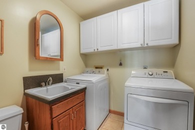 Located just blocks from Lake Michigan and adjacent to Manistee on Manistee Golf and Country Club in Michigan - for sale on GolfHomes.com, golf home, golf lot