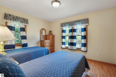 Located just blocks from Lake Michigan and adjacent to Manistee on Manistee Golf and Country Club in Michigan - for sale on GolfHomes.com, golf home, golf lot