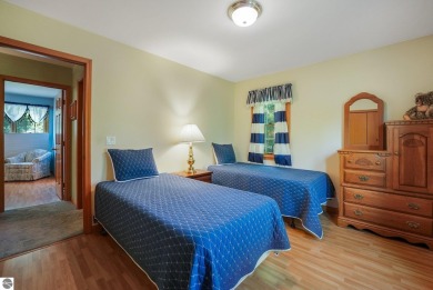 Located just blocks from Lake Michigan and adjacent to Manistee on Manistee Golf and Country Club in Michigan - for sale on GolfHomes.com, golf home, golf lot