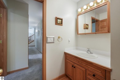 Located just blocks from Lake Michigan and adjacent to Manistee on Manistee Golf and Country Club in Michigan - for sale on GolfHomes.com, golf home, golf lot
