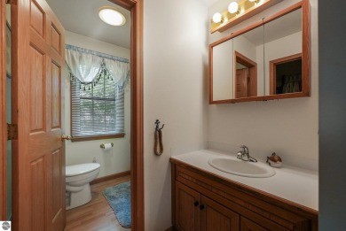 Located just blocks from Lake Michigan and adjacent to Manistee on Manistee Golf and Country Club in Michigan - for sale on GolfHomes.com, golf home, golf lot
