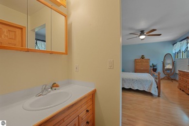 Located just blocks from Lake Michigan and adjacent to Manistee on Manistee Golf and Country Club in Michigan - for sale on GolfHomes.com, golf home, golf lot