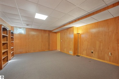 Located just blocks from Lake Michigan and adjacent to Manistee on Manistee Golf and Country Club in Michigan - for sale on GolfHomes.com, golf home, golf lot