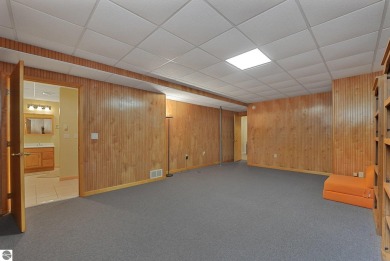 Located just blocks from Lake Michigan and adjacent to Manistee on Manistee Golf and Country Club in Michigan - for sale on GolfHomes.com, golf home, golf lot