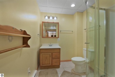 Located just blocks from Lake Michigan and adjacent to Manistee on Manistee Golf and Country Club in Michigan - for sale on GolfHomes.com, golf home, golf lot
