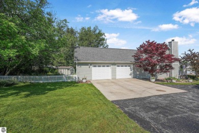 Located just blocks from Lake Michigan and adjacent to Manistee on Manistee Golf and Country Club in Michigan - for sale on GolfHomes.com, golf home, golf lot