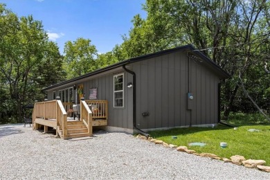 Welcome to your private retreat in the woods! This custom-built on Linn Valley Lakes - Deer Trace Golf Course in Kansas - for sale on GolfHomes.com, golf home, golf lot