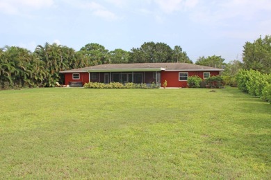 Your own private paradise in this 3/2/2 CBS home in desirable on Martin County Golf Course in Florida - for sale on GolfHomes.com, golf home, golf lot