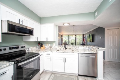 Welcome to this beautifully remodeled condo in the section of on Cove Cay Country Club in Florida - for sale on GolfHomes.com, golf home, golf lot