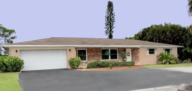 Your own private paradise in this 3/2/2 CBS home in desirable on Martin County Golf Course in Florida - for sale on GolfHomes.com, golf home, golf lot