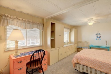 Cute and cozy fully furnished home offering relaxed on Barefoot Bay Golf Course in Florida - for sale on GolfHomes.com, golf home, golf lot